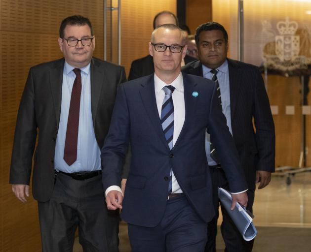 David Clark, flanked by colleagues Grant Robertson (left) and Kris Faafoi, arrives at Thursday’s...