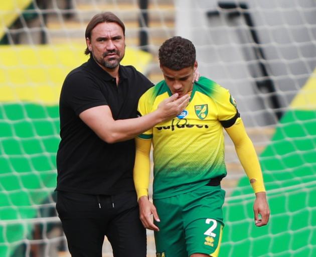 Norwich City manager Daniel Farke consoles young fullback Max Aarons after their defeat to West...