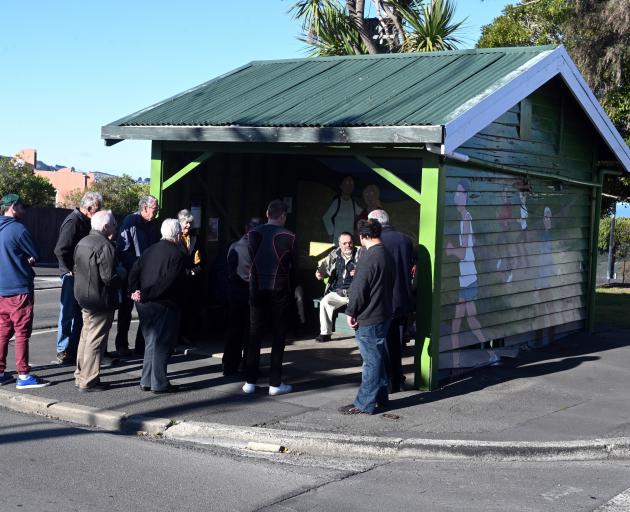 About 20 people attended a meeting to discuss the potential removal of a historic bus stop from...
