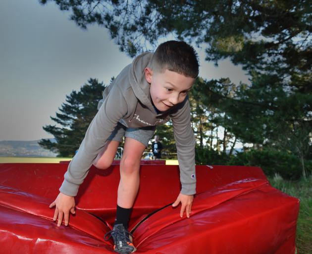 Hugo Beeby (9), of Dunedin, tackles the crash-pad obstacle in a cross-country event at Rotary...