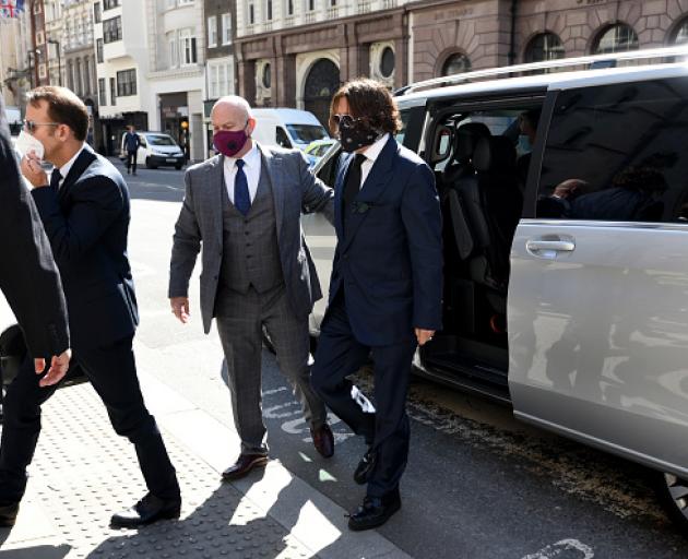 Johnny Depp, wearing a face mask, arrives at the High Court in London. Photo: Getty Images