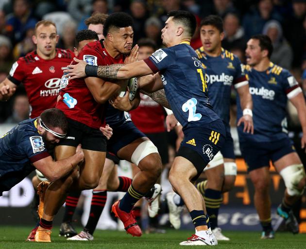 The Crusaders dominated the ball, forcing the Highlanders to make 78 more tackles. Photo: Getty...