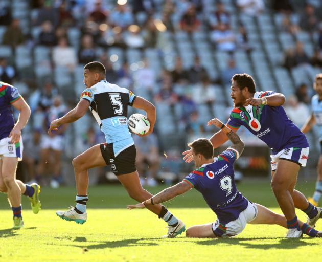 Ronaldo Mulitalo of the Sharks skips through the Warriors defence. Photo: Getty Images