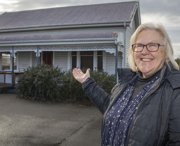 Reverend Phyllis Harris in front of the Lincoln Union Church’s old manse building that is being...