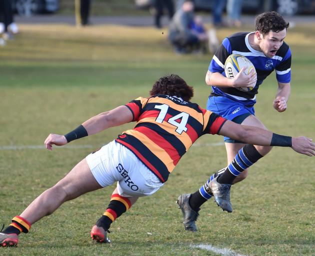 Kaikorai winger Jordan McEntee attempts to get past Zingari-Richmond opposite Willie Time at...