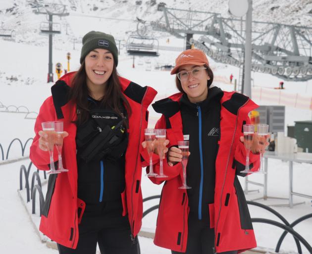 Remarkables staff Kendra Stronach (left) and Alex Laframboise enjoy a drink on the ski resort's...