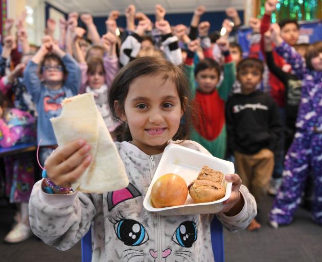Chloe Prasad (7) and other Pine Hill School pupils are big fans of the Government’s free lunches....