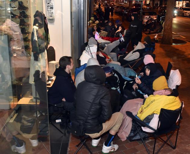 Dozens camped out in George St on Thursday night to buy a pair of the shoes.