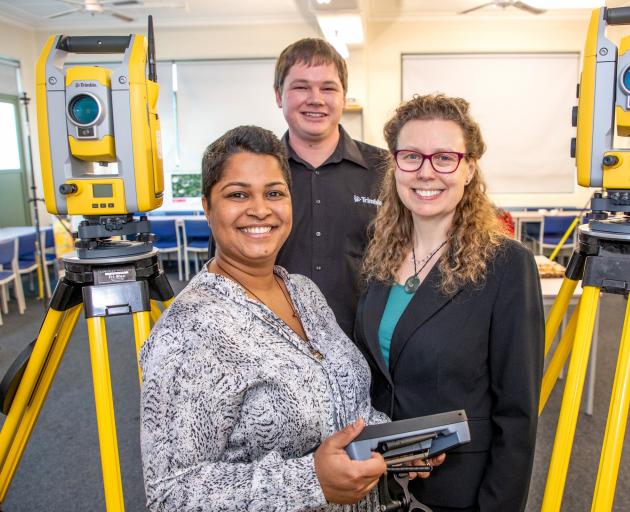 Inspecting robotic total stations at the University of Otago's School of Surveying earlier this...