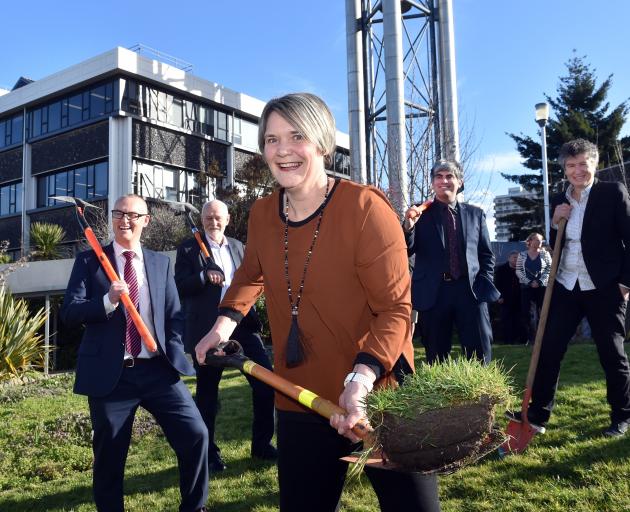 Otago Polytechnic chief executive Megan Gibbons (centre) breaks ground at the site of a planned...