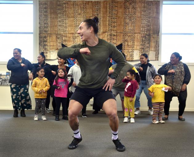 Dunedin researcher Troy Tararo-Ruhe joins members of the Dunedin Pasifika community in dance...