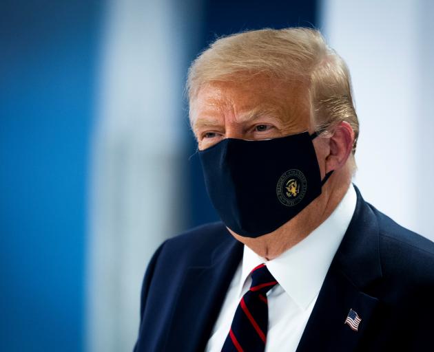 US President Donald Trump wears a protective face mask. Photo: Reuters