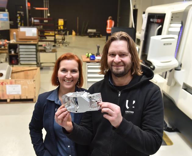 Sarah and Alex Ramsay show off a CNC-milled component in their new factory room at United...