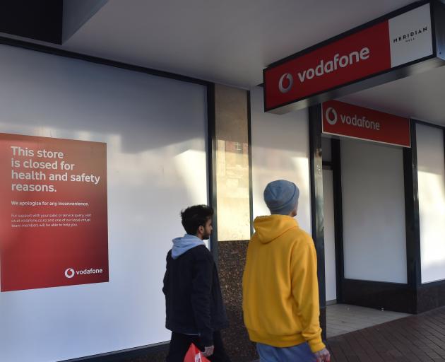 The Vodafone shop in George St has a closed sign in the window. PHOTO: PETER MCINTOSH
