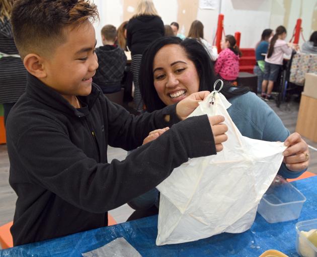 Phoenix Tuhega-Vaitapu (8) and his mother, Gemma Tuhega, of Mosgiel, put the finishing touches on...