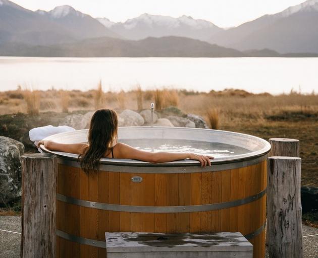 A soak in a hot tub at  Fiordland Lodge helps recharge your  batteries in time for your next day...
