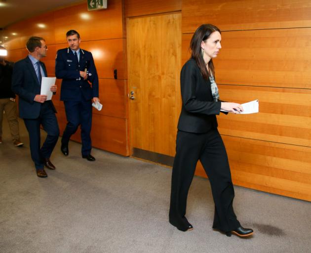 Prime Minister Jacinda Ardern arrives at a press conference at Parliament today following last...