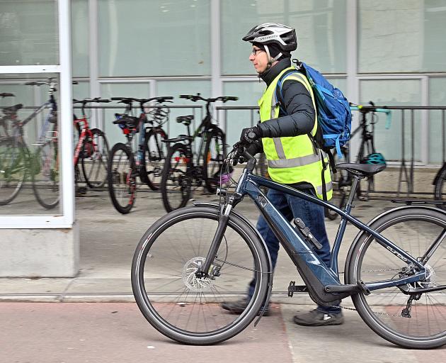 Associate Prof Christopher Holmes, of the University of Otago theology department, pushes his e...