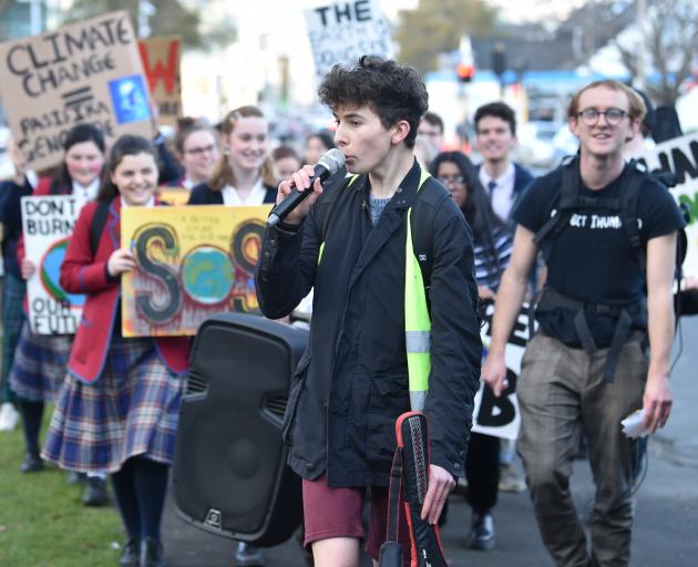 Zak Rudin leads young climate change activists as they march from the Museum Reserve to Labour MP...