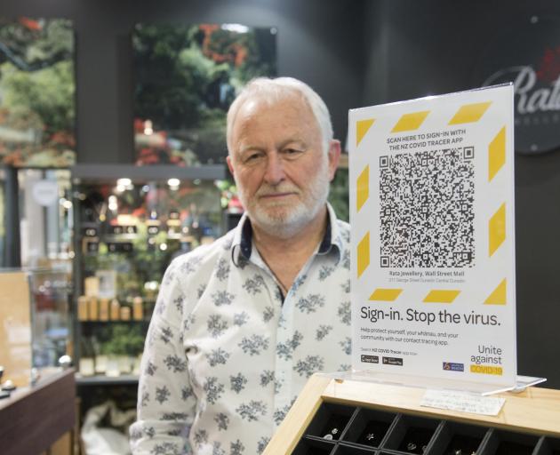 Rata owner Keith Clifford's shop in Dunedin displays the QR code for a tracing app. Photo: Gerard...