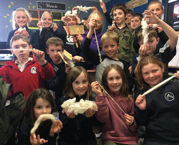 Mt Somers Springburn School year 4 and 5 pupils show the different stages of wool. PHOTO: TONI...