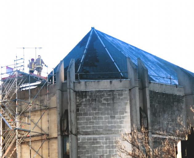 Firefighters assess the damage to St Paul's Cathedral following a fire in the roof this morning. Photo: Craig Baxter Firefighters assess the damage to St Paul's Cathedral following a fire in the roof this morning. Photo: Craig Baxter