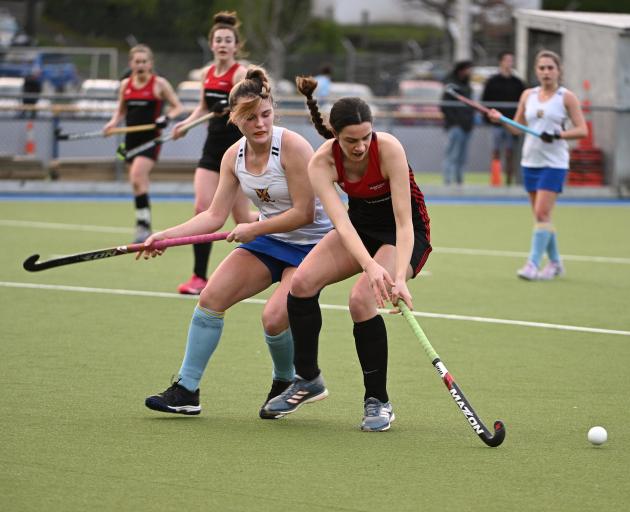 Momona’s Angelique Peyroux (right) looks to control the ball as University’s Lucy Griffith chases...