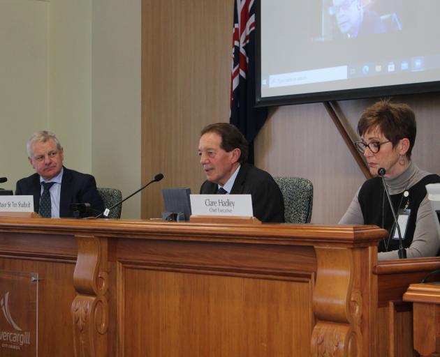 Independent governance expert Bruce Robertson (left), Mayor Sir Tim Shadbolt and chief executive...