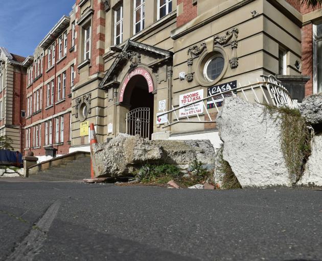 The solid fence at the front of King Edward Court in Stuart St has remained damaged for about two...