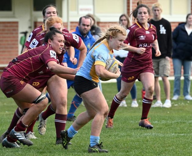 University No 7 Leah Miles makes a run with the ball at Womens' club rugby final against Alhambra Union today. PHOTO: LINDA ROBERTSON