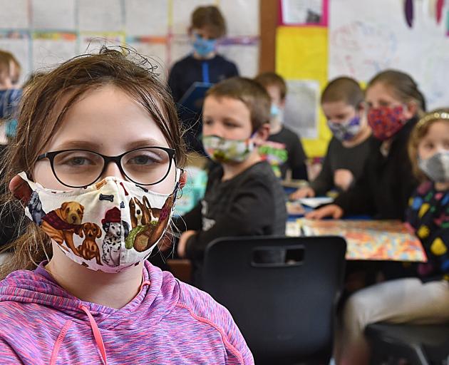 North East Valley Normal School pupil Annalise Miller (8) participates in the school’s Masks on...