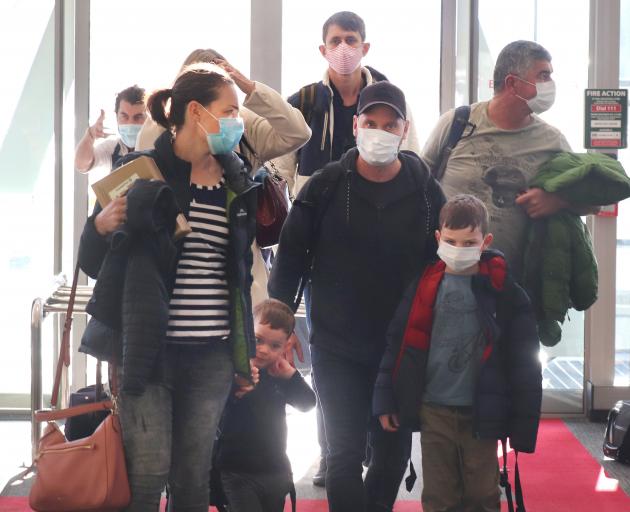 Travellers on a flight from Auckland arrive at Queenstown Airport yesterday. PHOTO: HUGH COLLINS

