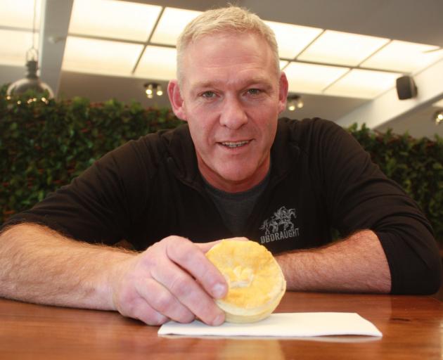 The Barn manager Adam Wilson holds one of the wallaby pies, which are proving popular with...