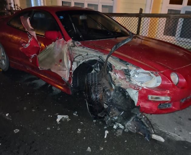 The parked car that was crashed into by a vehicle twice. Photo: Supplied