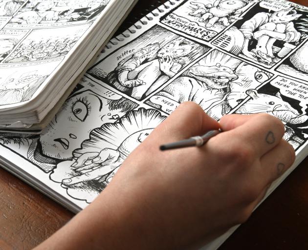 Veronica Brett puts some final touches on a cartoon. PHOTO: LINDA ROBERTSON