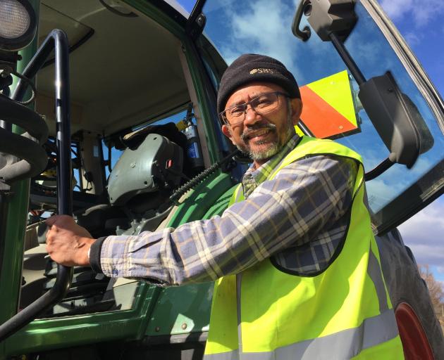 Reynold Alvins has changed careers from a tour bus driver in Queenstown to a tractor driver in...
