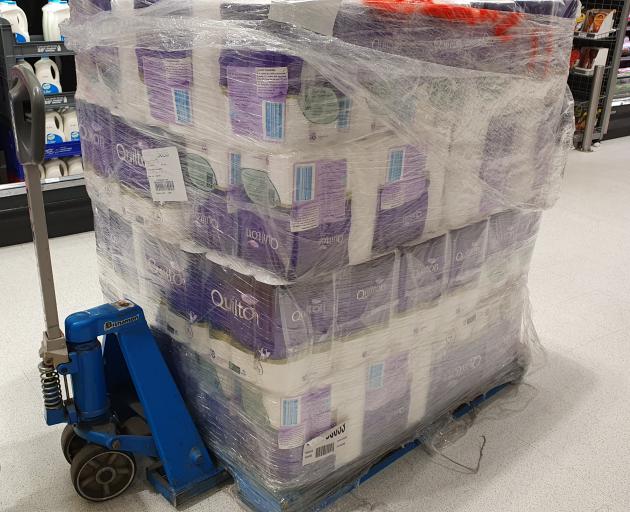 A pallet of toilet paper is pulled out to restock the shelves in Countown Frankton. Photo: Matthew Mckew