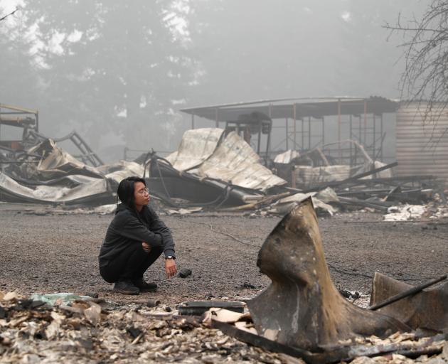 Hansel Valentine at the remains of the burnt down property of her relatives, as the wildfire...