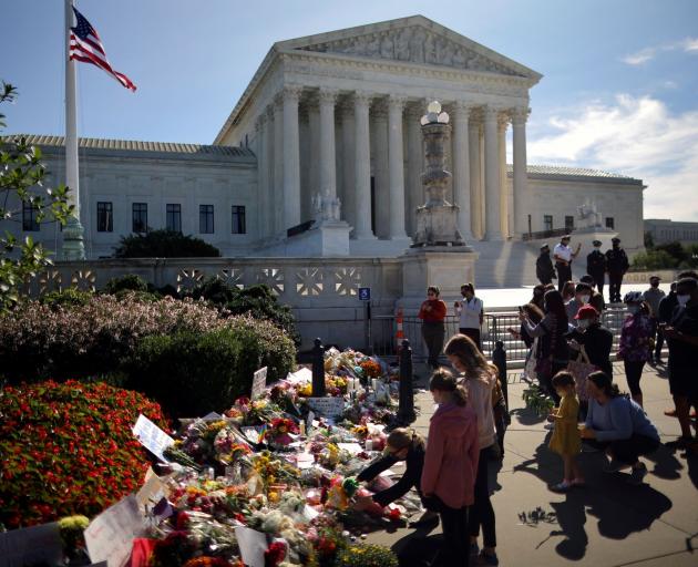 Flowers were left in front of the US Supreme Court following the death of Justice Ruth Bader...