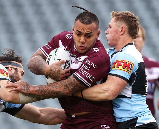 Manly prop Addin Fonua-Blake takes the ball into a tackle against the Sharks earlier this year....