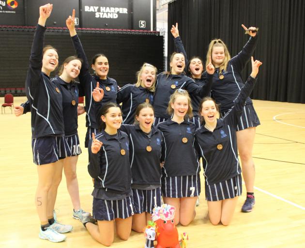 The St Hilda’s Collegiate team celebrates after winning the Otago-Southland secondary schools...