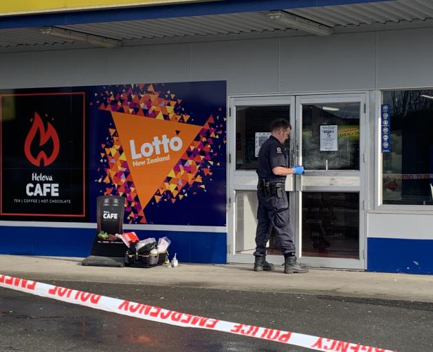 A police officer examining the scene in Invercargill today. Photo: Abbey Palmer A police officer examining the scene in Invercargill today. Photo: Abbey Palmer
