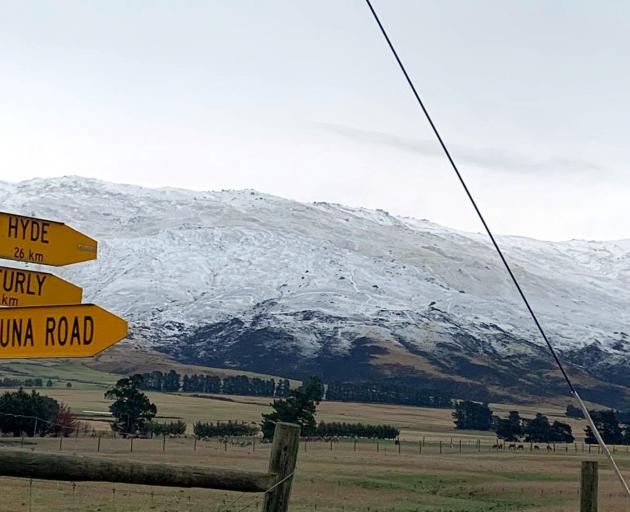 Snow blankets the hills near Middlemarch yesterday, putting out the fire that burned the night...