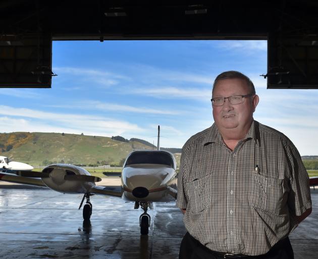 Mainland Air owner Phil Kean with one of the flight school’s planes in the hanger at Dunedin...