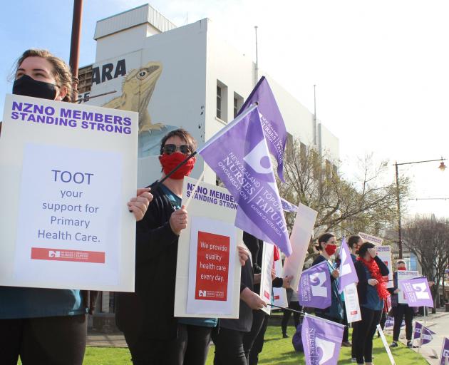 Nurses and administration staff from Invercargill and Bluff lined up on Dee St yesterday asking...