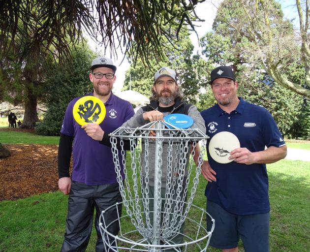 Enjoying the Queenstown Classic disc golf competition yesterday are the event’s organisers (from...
