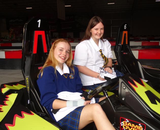 Sophia Gibbons (left) and Georgia Small show off their flaming kart designs. PHOTO: GUY WILLIAMS