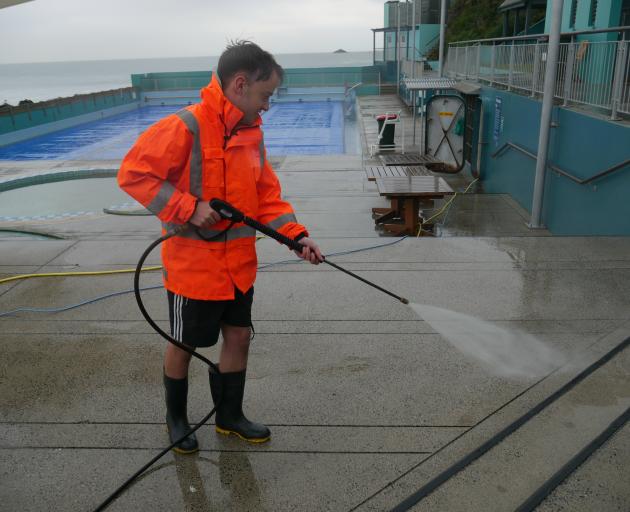 St Clair Hot Salt Water Pool duty supervisor Tait Familton prepares the pool for its opening day...