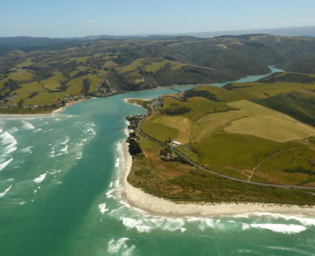 This photograph of Taieri Mouth, taken in 2016, shows a deeper water channel to the north, but...