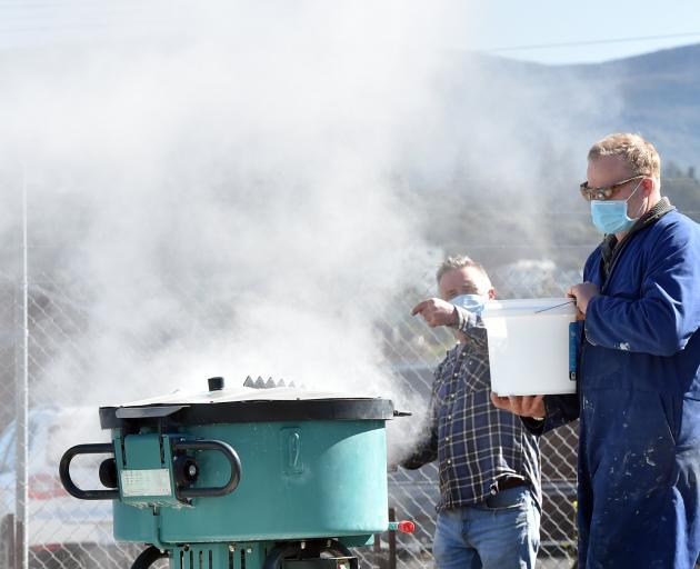 Artist Tim Barlow makes a ‘‘hot mix’’ of lime cement at Zeal Steel’s yard in Dunedin to use in...